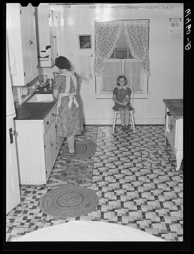 Mrs. Hersch in kitchen of farm unit. Red River Valley Farms, North Dakota