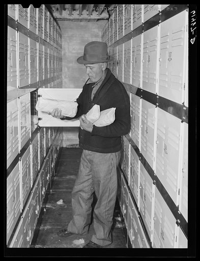 Getting meats out of cold storage locker. Hillsboro, North Dakota