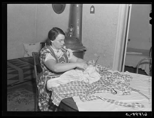 Mrs. Sauer with dress she is making. Cavalier County, North Dakota