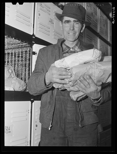 Farmer with arms full of food from cold storage locker. Hillsboro, North Dakota