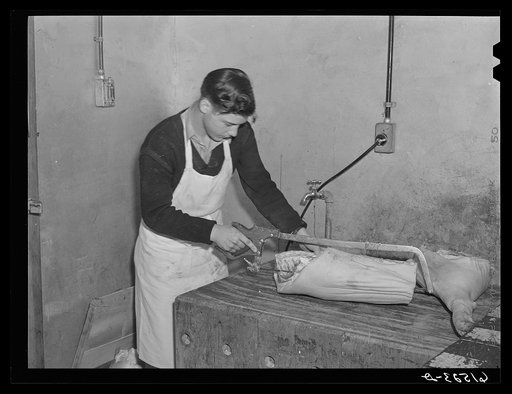 After meat is chilled, cuts and roasts are cut off and wrapped, stamped, and put in freezing room. Cold storage lockers. Casselton, North Dakota