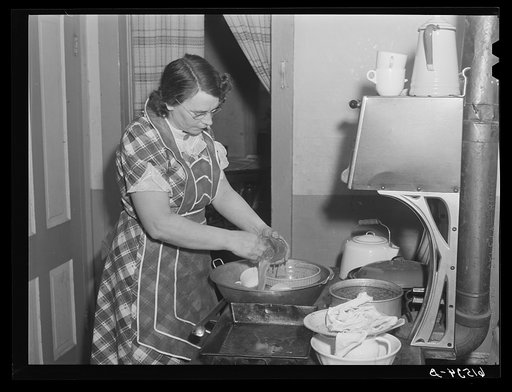 Mrs. Sauer washing dishes. Cavalier County, North Dakota