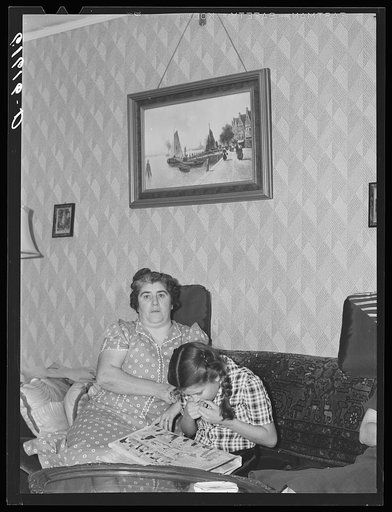 Untitled photo, possibly related to: One of the Schulstead children reading funny papers. Aberdeen, South Dakota