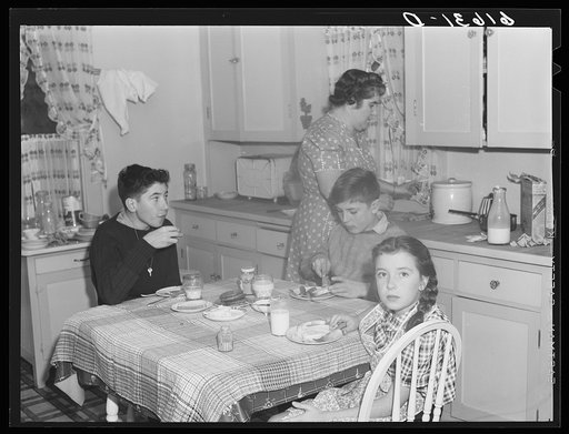 Untitled photo, possibly related to: One of the Schulstead children reading funny papers. Aberdeen, South Dakota