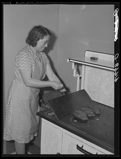 Untitled photo, possibly related to: Farm woman (German-Russian) and two daughters. McIntosh County, North Dakota