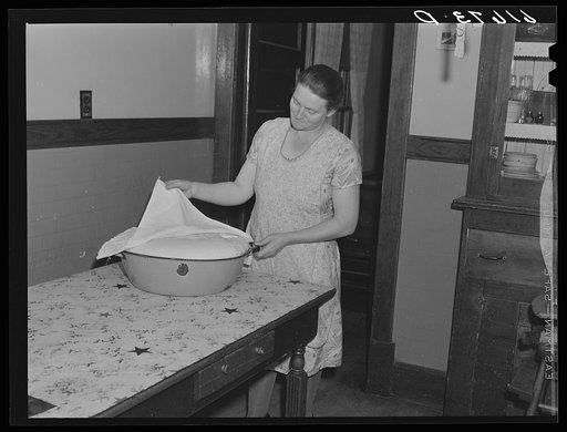 Mrs. Bettenhausen with bread she is baking. McIntosh County, North Dakota