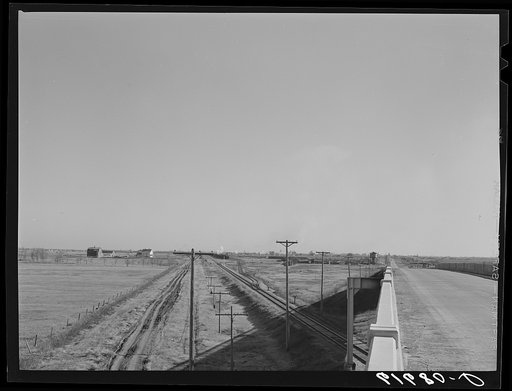 Country road, railroad, and highway leading into Groton, South Dakota