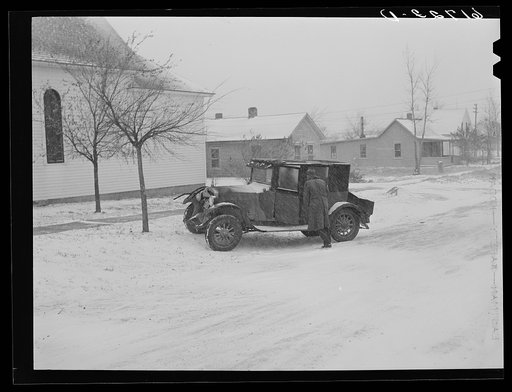 Untitled photo, possibly related to: Putting blanket over auto radiator. Miller, South Dakota
