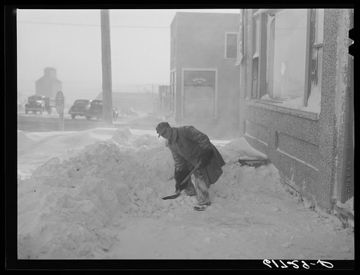 Shoveling snow. Draper, South Dakota