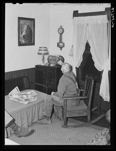 Farmer tuning in radio. Meeker County, Minnesota