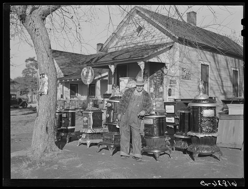 Man who operates small grocery store and secondhand furniture store in his home. Chanute, Kansas
