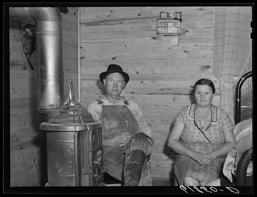Untitled photo, possibly related to: Agricultural day laborer, wife and daughter in new home built by FSA (Farm Security Administration). New Madrid County, Missouri