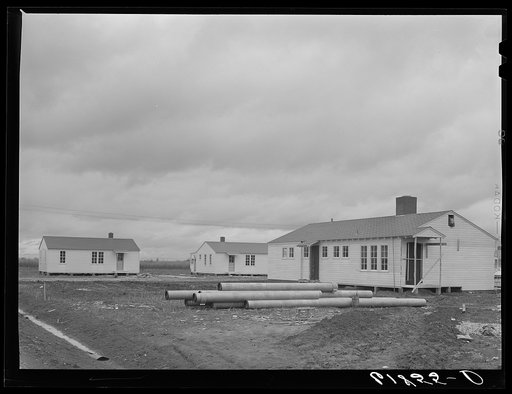 Utility building and some of the houses at Morehouse group of labor homes. New Madrid County, Missouri