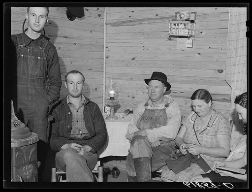 Agricultural day laborer with wife and son in their new home. One of the FSA (Farm Security Administration) scattered labor homes in New Madrid County, Missouri