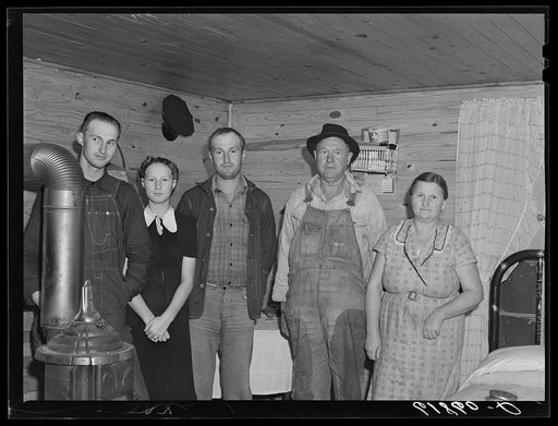 Family of agricultural day laborer living in one of the four room scattered labor homes built by FSA (Farm Security Administration) at a cost of five hundred dollars. New Madrid County, Missouri