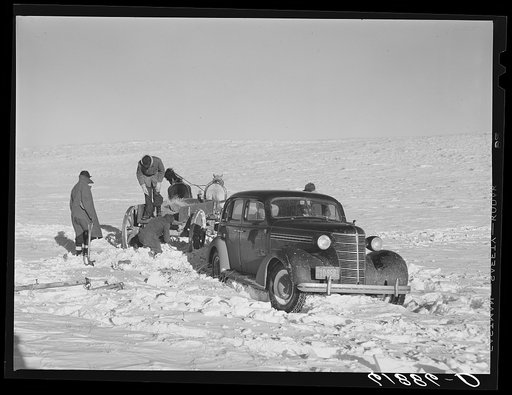 Pulling government car out of snowdrift. Todd County, South Dakota
