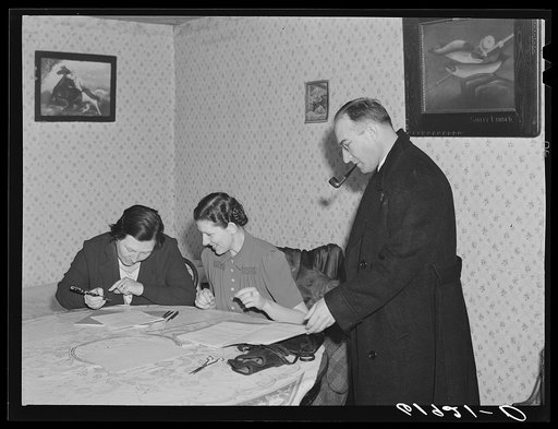Home supervisor and county supervisor helping wife of FSA (Farm Security Administration) borrower with account book. Labette County, Kansas