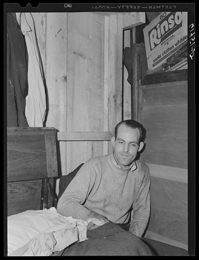 Untitled photo, possibly related to: W.W. McDaniel, rigger at Hercules powder plant, in his bunkhouse in the rear of Mrs. Pritchard's boardinghouse. Radford, Virginia