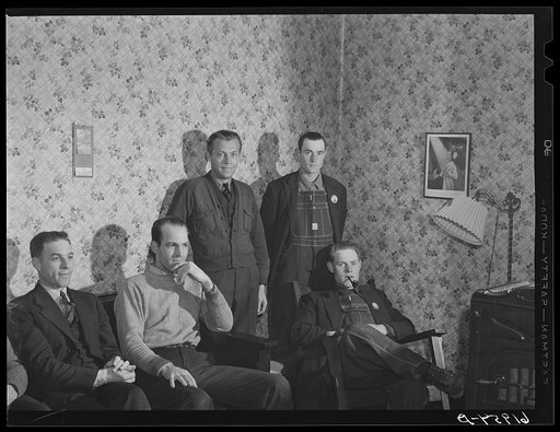 Five of the boarders at Mrs. Pritchard's house in the parlor. Eighteen men board here. Radford, Virginia