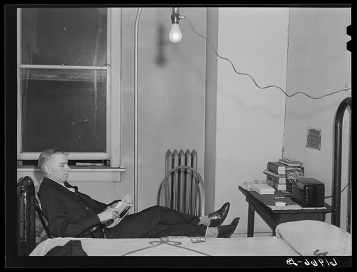 Out of state employee of Hercules powder plant in his room at Mrs. Sells boardinghouse. Radford, Virginia