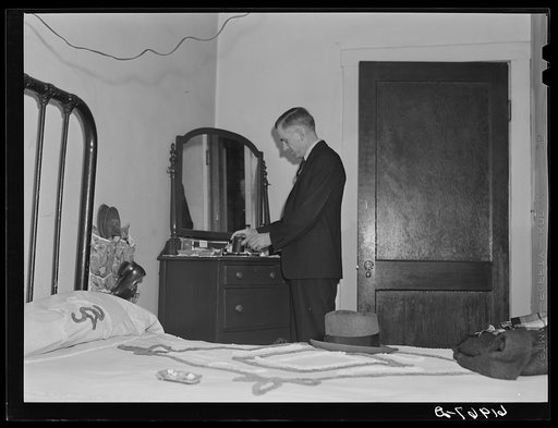 Untitled photo, possibly related to: Out of state employee of Hercules powder plant in his room at Mrs. Sells boardinghouse. Radford, Virginia