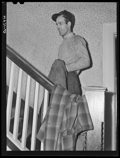 Untitled photo, possibly related to: Powder plant employee going upstairs. Mrs. Pritchard's boardinghouse. Radford, Virginia