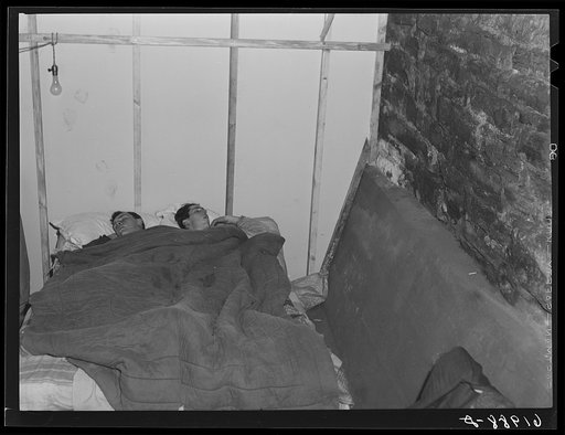 Two boys employed at powder plant sleeping in basement of Mr. Tilly's furniture store. Radford, Virginia