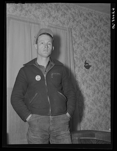 Paul McDaniel with his laborer's button. Each employee wears an identification