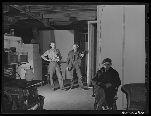 Men in the basement of Mr. Tilly's secondhand furniture store. He is fixing up living quarters for fifty. Radford, Virginia