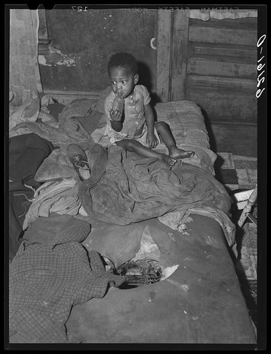 One of five children living with mother in two-room slum dwelling. Aliquippa, Pennsylvania