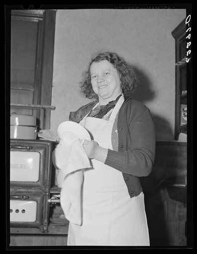 Woman drying dishes. Ambridge, Pennsylvania