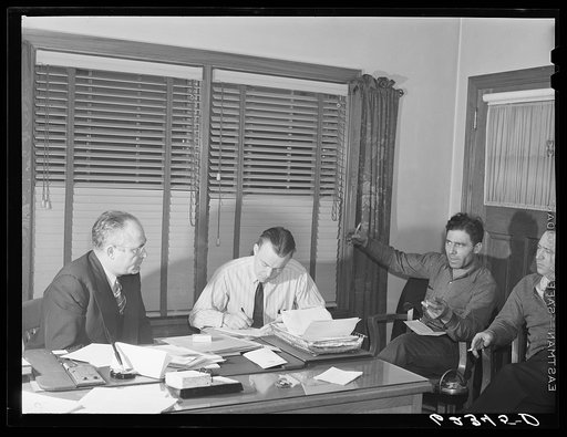 Subregional office, steelworkers organizing committee, Ambridge, Pennsylvania. Subregional director Joe Timko (left) listens to local union president Thomas Peasner (right) give the union committee's position on a grievance which is being appealed to the national union