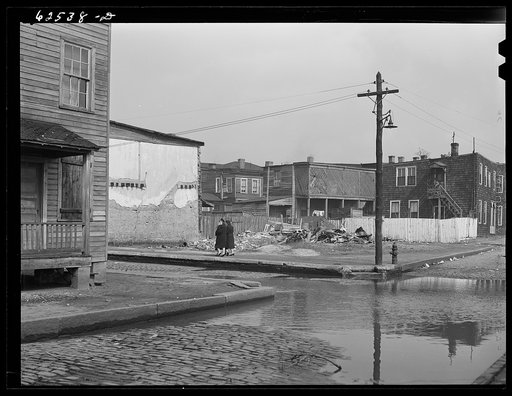 Untitled photo, possibly related to: Backed up sewer in Negro slum district. Norfolk, Virginia