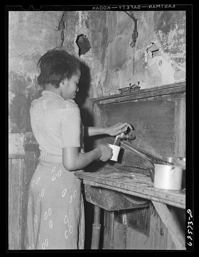 Kitchen in house which rents for sixteen dollars per month. Negro slum district. Norfolk, Virginia