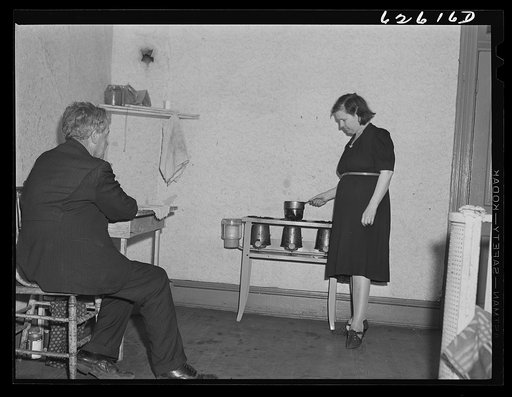 Man and wife from South Carolina. He just got a job in shipyards, moved into this one room apartment, rent eight dollars a week. Newport News, Virginia