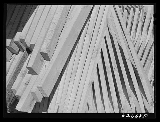 Untitled photo, possibly related to: Stacked lumber. Tappahannock, Virginia