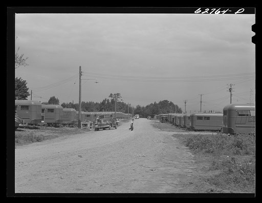 Untitled photo, possibly related to: "Trailer service unit" of water faucet and garbage pail is provided for every ten trailers at FSA (Farm Security Administration) camp. Erie, Pennsylvania