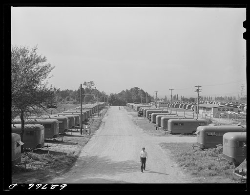 Untitled photo, possibly related to: "Trailer service unit" of water faucet and garbage pail is provided for every ten trailers at FSA (Farm Security Administration) camp. Erie, Pennsylvania