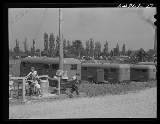 "Trailer service unit" of water faucet and garbage pail is provided for every ten trailers at FSA (Farm Security Administration) camp. Erie, Pennsylvania