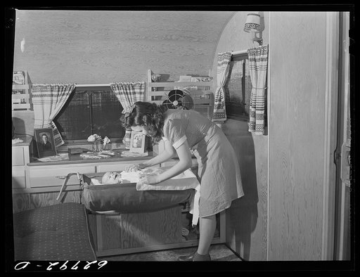 Wife and child of worker at General Electric plant in trailer home at FSA (Farm Security Administration) camp. Erie, Pennsylvania