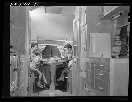 General Electric worker from Alabama at dinner with family in trailer home. FSA (Farm Security Administration) camp, Erie, Pennsylvania