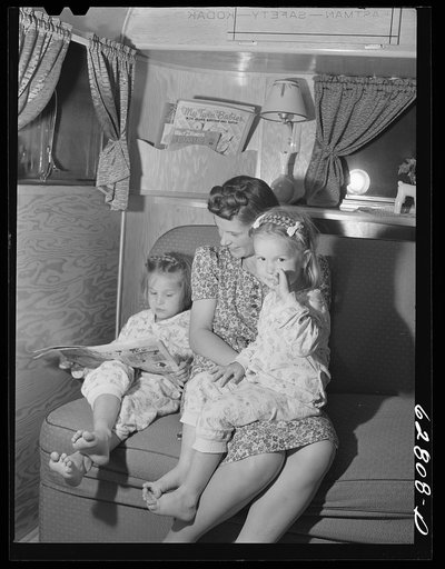 Mrs. Jack Cutter and two children in their trailer at FSA (Farm Security Administration) camp, Erie, Pennsylvania. Her husband is at work on the night shift in the General Electric plant