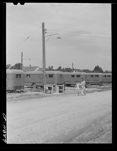Untitled photo, possibly related to: Each group of ten trailers in the FSA (Farm Security Administration) camp at Erie has a "trailer service unit," water faucet, slop sink, and garbage pail