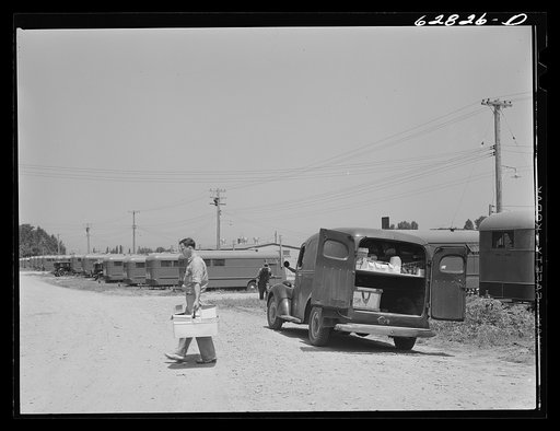 Grocery truck making delivery to trailer. FSA (Farm Security Administration) camp, Erie, Pennsylvania. There are no stores or shops within walking distance of the camp