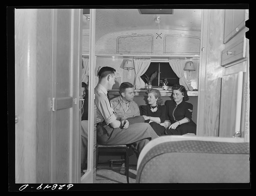 Untitled photo, possibly related to: Evening visitors at the trailer of Milton B. Ackerman, FSA (Farm Security Administration) camp manager. Erie, Pennsylvania