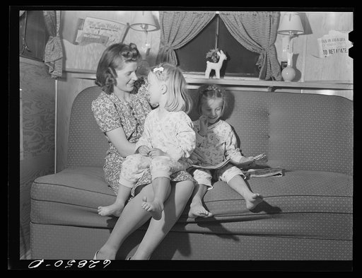 Untitled photo, possibly related to: Mrs. Jack Cutter and two children in their trailer at FSA (Farm Security Administration) camp, Erie, Pennsylvania. Her husband is at work on the night shift in the General Electric plant