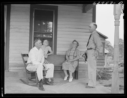 Lieutenant Sedgewick of United States Navy talking with Luther Corbin and his family. Martin County, Indiana