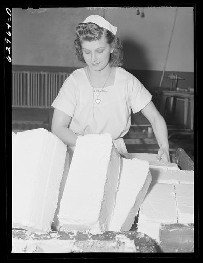 Preparing butter for cutting and packing. Land O'Lakes plant, Chicago, Illinois