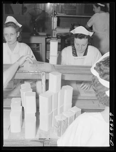 Untitled photo, possibly related to: Wrapping butter by hand. Land O'Lakes plant, Chicago, Illinois