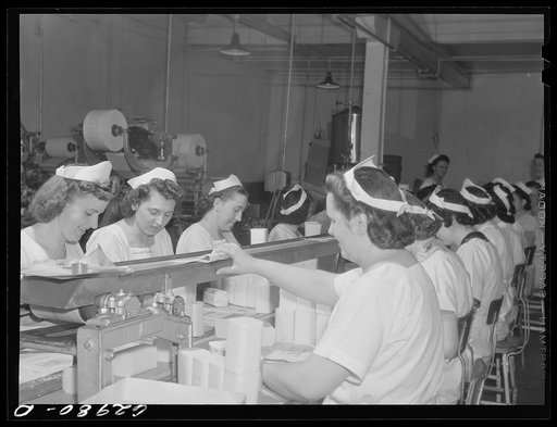 Wrapping butter by hand. Land O'Lakes plant, Chicago, Illinois
